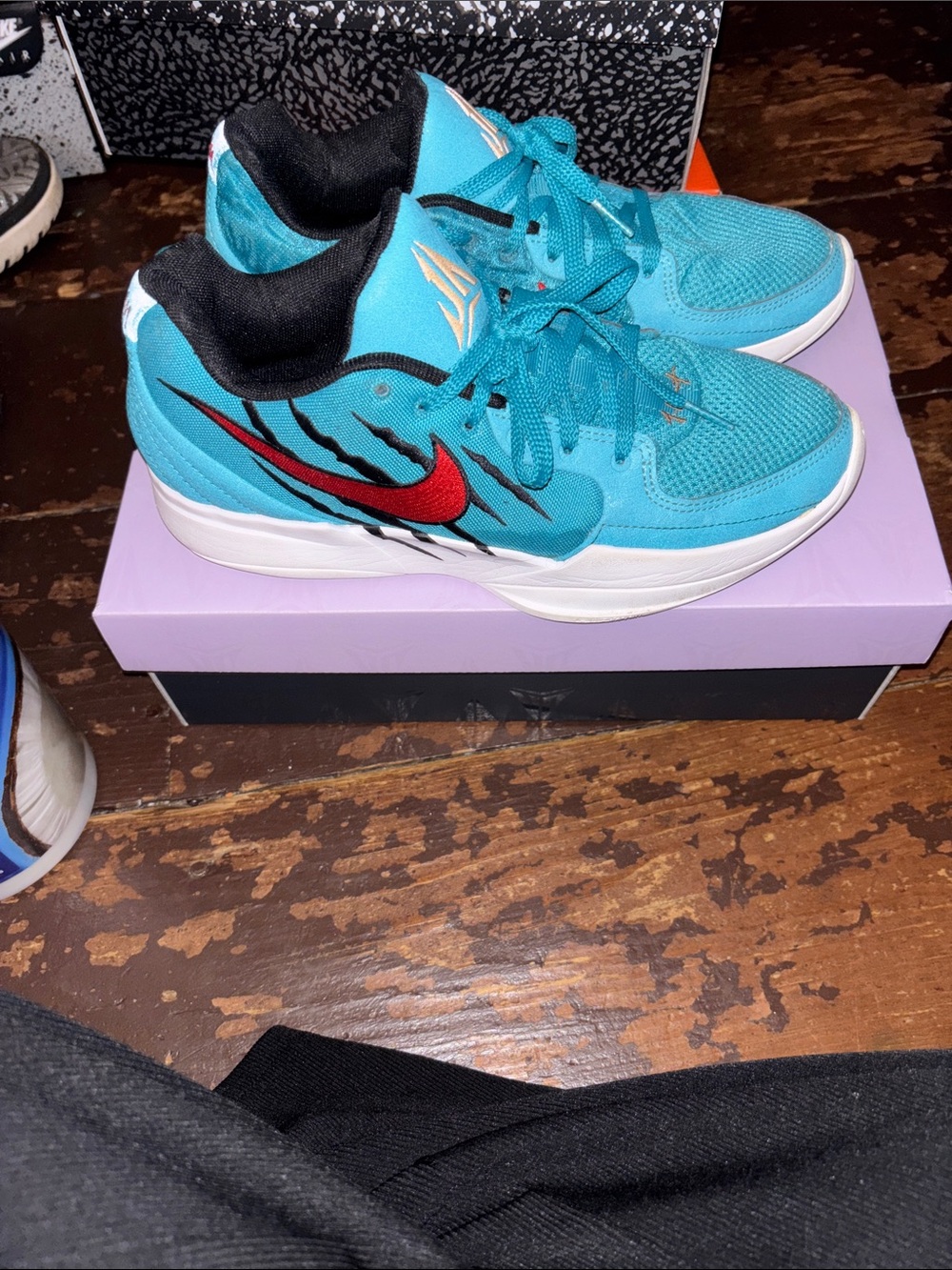 Nike Men’s Turquoise Sneakers with Red Swoosh
